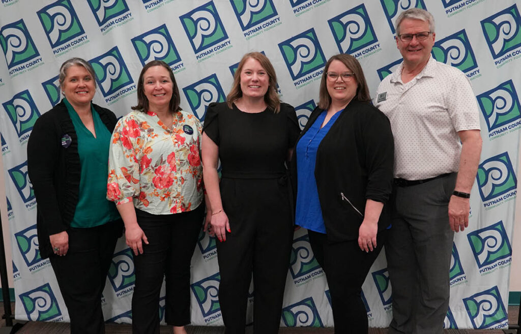PCCF staff against Putnam logo wall