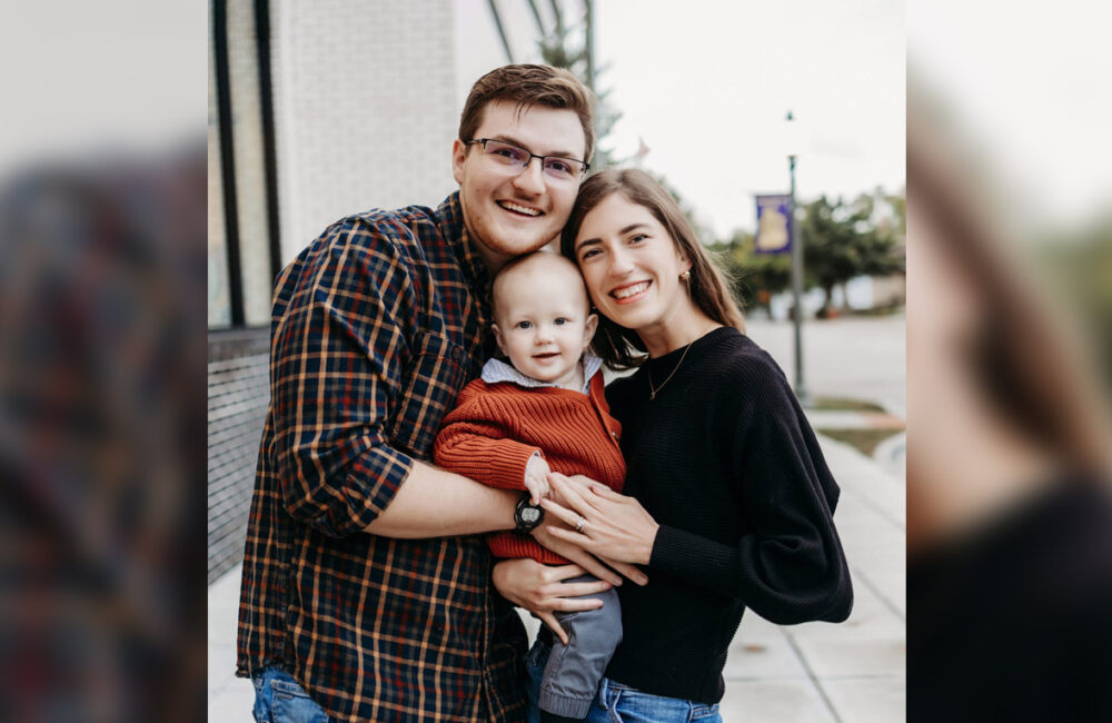 a father, mother and infant boy portrait outside